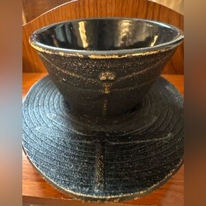 Cast iron Japanese tea cup and saucer.